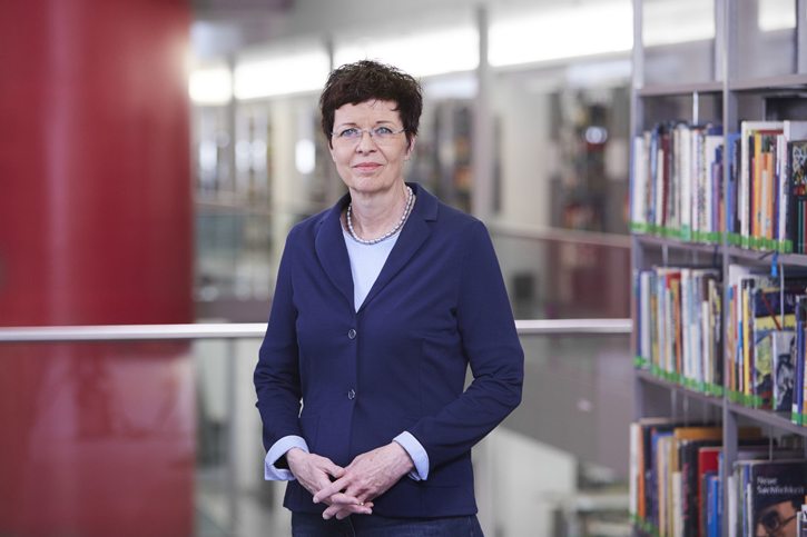 Portrait of Dr. Sabine Homilius Portrait of Dr. Sabine Homilius, book shelf in the background